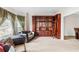 Living room with built-in shelving and hardwood floors at 3680 Edenbourgh Pl, Marietta, GA 30066