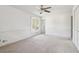 Bright bedroom featuring a large window and ceiling fan at 140 Creek Cir, Stockbridge, GA 30281