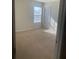 Bright bedroom with carpeted floor and window at 539 Greyhawk Way, Fairburn, GA 30213
