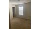 Simple bedroom with carpeted floor and window at 539 Greyhawk Way, Fairburn, GA 30213