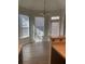 Bright breakfast nook with wood flooring and multiple windows at 539 Greyhawk Way, Fairburn, GA 30213