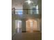 Two-story entryway with hardwood floors, and open staircase at 539 Greyhawk Way, Fairburn, GA 30213