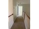 Upstairs hallway with carpeted floor and wooden railing at 539 Greyhawk Way, Fairburn, GA 30213