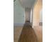 Hallway with hardwood floor and archways at 539 Greyhawk Way, Fairburn, GA 30213