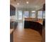 Kitchen with dark wood cabinets, tile backsplash and light flooring at 539 Greyhawk Way, Fairburn, GA 30213