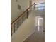 Open staircase with wooden handrail and white spindles at 539 Greyhawk Way, Fairburn, GA 30213