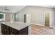 Open concept kitchen with island and white cabinets at 1764 Corley Dr, Mableton, GA 30126