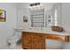 Clean bathroom with wood vanity and large mirror at 1204 Bridle Path, Marietta, GA 30068