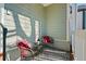 Cozy front porch with two chairs and a small table at 1204 Bridle Path, Marietta, GA 30068