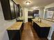 Modern kitchen featuring granite countertops and dark cabinetry at 1241 St James Pl, Loganville, GA 30052