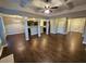 Open living space with hardwood floors, high ceilings, and a kitchen view at 1241 St James Pl, Loganville, GA 30052