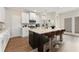 Spacious kitchen with white cabinets, an island, and stainless steel appliances at 90 Colonial Ter, Villa Rica, GA 30180