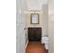 Small bathroom with dark vanity, toilet and white tile at 2179 Mainsail Dr, Marietta, GA 30062