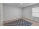 Empty bedroom with gray polka dot rug and window at 3759 Chapel Cove, Douglasville, GA 30135