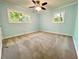 Spacious bedroom with light blue walls and carpeting at 1504 Sycamore Nw Dr, Kennesaw, GA 30152