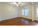 Bright dining room with hardwood floors and large window at 204 Providence Ln, Canton, GA 30144