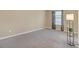 Spacious bedroom with neutral carpeting and ample natural light at 3253 Lowland Dr, Douglasville, GA 30135