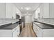 Renovated kitchen boasts modern appliances and white cabinets at 1573 Deerwood Ln, Acworth, GA 30102