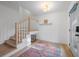 Modern entryway featuring a staircase and stylish rug at 698 Eustace Se St, Atlanta, GA 30315