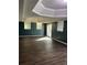 Finished basement with dark hardwood floors and a high ceiling at 4365 Miners Creek Rd, Lithonia, GA 30038