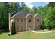 Two story house with beige exterior, large windows, and a landscaped yard at 4365 Miners Creek Rd, Lithonia, GA 30038