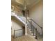 Elegant wooden staircase with a chandelier and hardwood floors at 4365 Miners Creek Rd, Lithonia, GA 30038