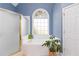 Bathroom with a garden tub, frosted shower door, and a large window at 212 Brackin Trce, Grayson, GA 30017