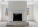 Modern fireplace with white mantel and brick hearth at 2909 Emerald Ln, Acworth, GA 30102