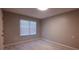 Well-lit bedroom with tile floors and window blinds at 209 E Wilson St # 144, Villa Rica, GA 30180