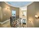 Upper landing with chandelier and ornate railing at 5473 Olde Plantation Dr, Douglasville, GA 30135