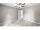 Simple bedroom with carpet and access to hallway at 736 Oxford Ct, Lilburn, GA 30047