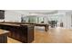 Partial view of a basement bar with dark wood cabinets and granite countertop at 6092 Carlisle Ln, Alpharetta, GA 30022