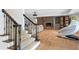 Basement stairs with dark wood railing and access to a Gathering room at 6092 Carlisle Ln, Alpharetta, GA 30022