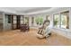 Finished basement features a comfortable seating area and a massage chair at 6092 Carlisle Ln, Alpharetta, GA 30022