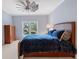 Bedroom with large window, a leather bed, and dresser at 6092 Carlisle Ln, Alpharetta, GA 30022