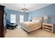 Light blue bedroom with a comfortable bed and seating area at 6092 Carlisle Ln, Alpharetta, GA 30022