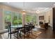 Breakfast area with round table, hardwood floors, and views of the backyard at 6092 Carlisle Ln, Alpharetta, GA 30022