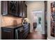 Butlers pantry with wine cooler, coffee maker, and ample storage at 6092 Carlisle Ln, Alpharetta, GA 30022