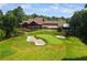Clubhouse with adjacent putting green at 6092 Carlisle Ln, Alpharetta, GA 30022