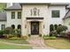 Stunning home exterior with stone accents and a double door entry at 6092 Carlisle Ln, Alpharetta, GA 30022