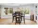 Game room with a table and chairs, offering a view of the backyard at 6092 Carlisle Ln, Alpharetta, GA 30022