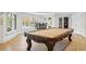 Basement game room featuring a pool table and access to backyard at 6092 Carlisle Ln, Alpharetta, GA 30022