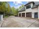Three-car garage with ample space and attractive exterior at 6092 Carlisle Ln, Alpharetta, GA 30022