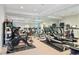 Well-equipped home gym with various exercise machines and mirrors at 6092 Carlisle Ln, Alpharetta, GA 30022