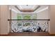 Ornate balcony overlooking a sunlit living room at 6092 Carlisle Ln, Alpharetta, GA 30022