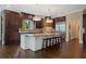 Gourmet kitchen with custom cabinetry, granite countertops, and high-end appliances at 6092 Carlisle Ln, Alpharetta, GA 30022