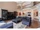 Open living area with sectional sofa, large TV, and built-in cabinetry at 6092 Carlisle Ln, Alpharetta, GA 30022