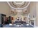 Two story living room with high ceilings, fireplace, and plenty of natural light at 6092 Carlisle Ln, Alpharetta, GA 30022