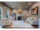 Spacious living room with fireplace, large windows, and comfortable seating at 6092 Carlisle Ln, Alpharetta, GA 30022