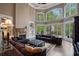 Living room boasts ample natural light, comfortable seating, and a cozy fireplace at 6092 Carlisle Ln, Alpharetta, GA 30022